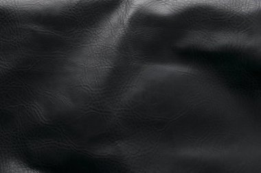 Dikişli siyah deri.