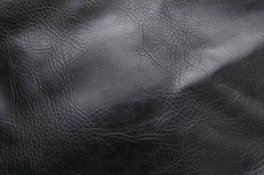 Dikişli siyah deri.