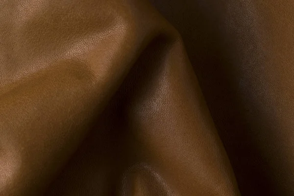 Viselése valódi természetes sötétbarna bőr textúra háttér, régi vintage valódi bőr. — Stock Fotó