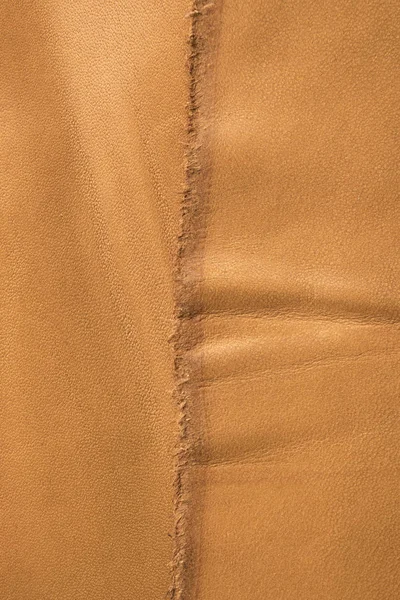Ljusbrunt läder bakgrundsstruktur och bakgrund. — Stockfoto