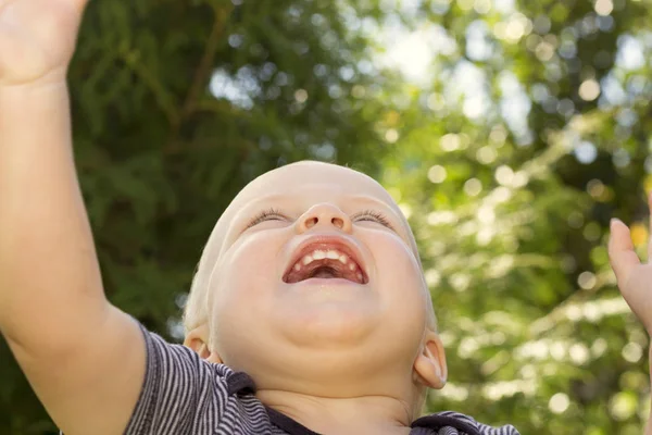 Concept of happiness .Close up portrait of smiling happy baby boy. Bottom view — Stock Photo, Image