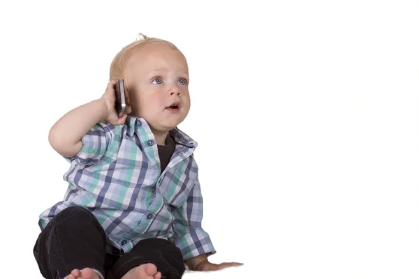 Cute toddler speaking on phone. Isolated.Copy space — Stock Photo, Image