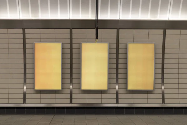 Three big vertical poster on metro station — Stock Photo, Image