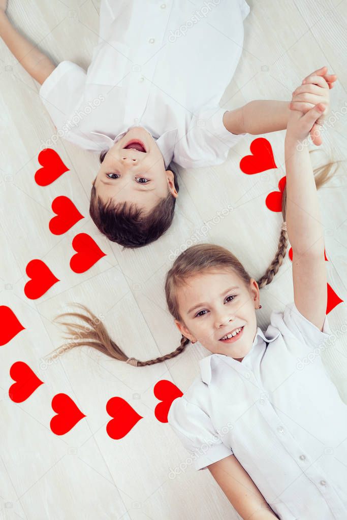 little boy and girl lying on the floor. Concept of happy Valentine day and Brother And Sister Together Forever