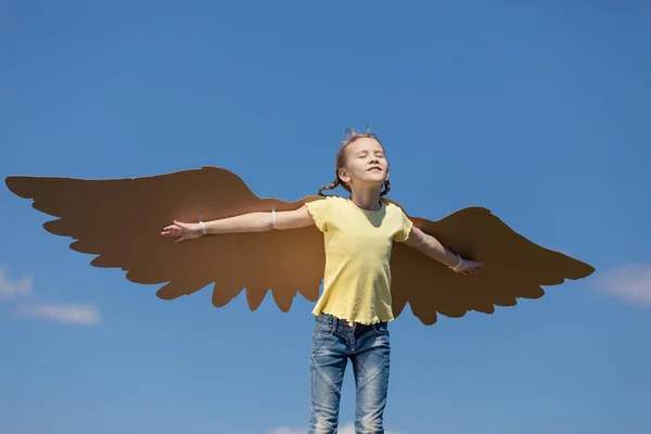 Little Girl Playing Cardboard Toy Wings Park Day Time Concept — Stock Photo, Image