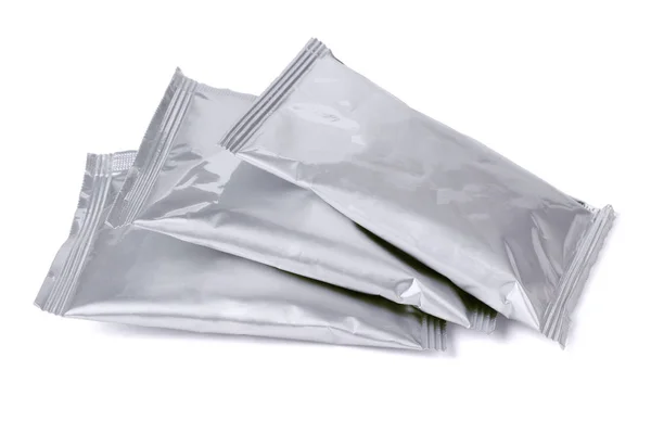 Три алюминиевых пакетика — стоковое фото