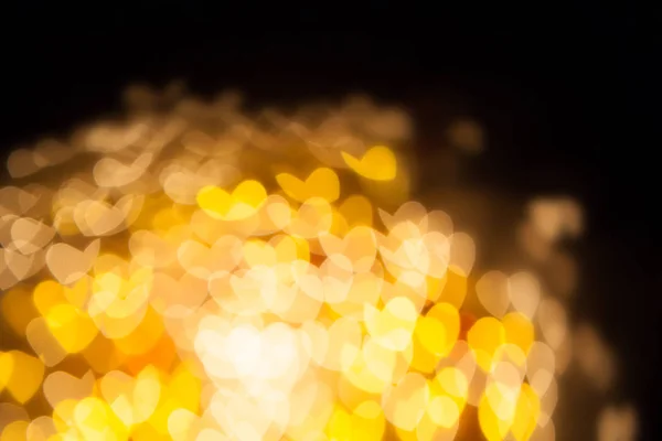 Bokeh of heart blur background as butterflies fly in the dark — Stock Photo, Image