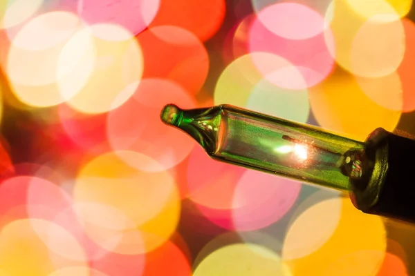 Christmas tree lights bulbs closeup on bokeh colorful — Stock Photo, Image