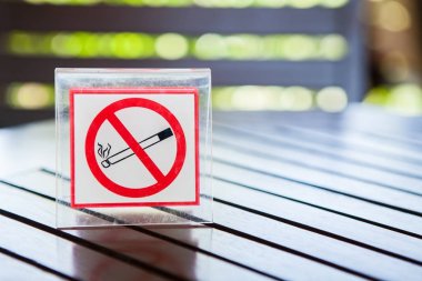 Signs of no smoking on the table clipart