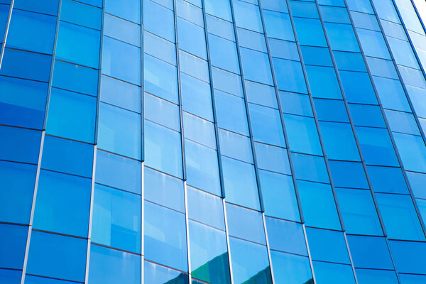 Modern architecture in blue tone,Windows on Skyscrapers,reflecti