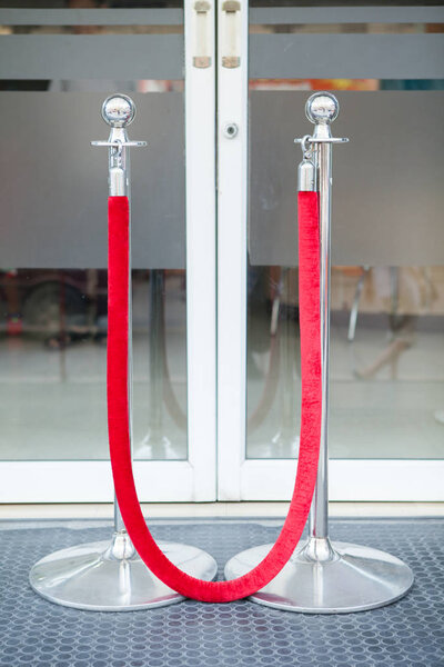 Stanchion or stand barriers in front of a door entrance