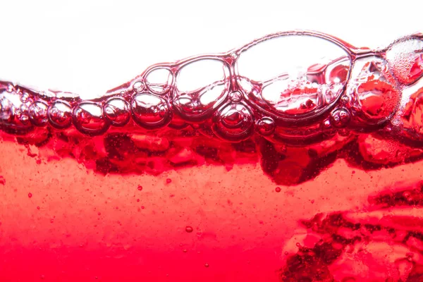 Red soda water splashing  with bubbles close up and Dew Point on — Stock Photo, Image