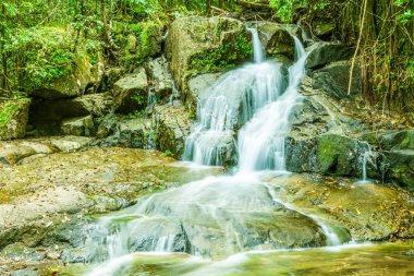 Tropical waterfall in the forest,Ton Chong Fa  in khao lak Phang clipart