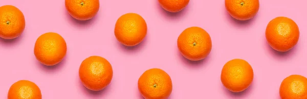 Fruit pattern, creative summer concept. Fresh juicy whole orange on pink background. Flat lay Top view. Minimalistic background with citrus fruits, vitamin C. Pop art design Banner.