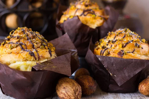 Crafting muffins with pistachios and chocolate