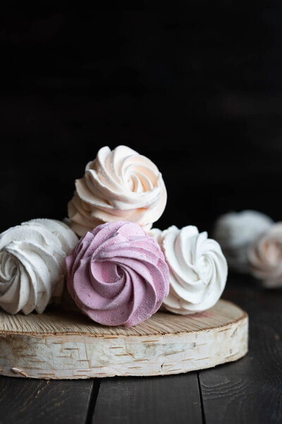 Assorted different flavors of homemade marshmallows. Peach, pink and white marshmallows.