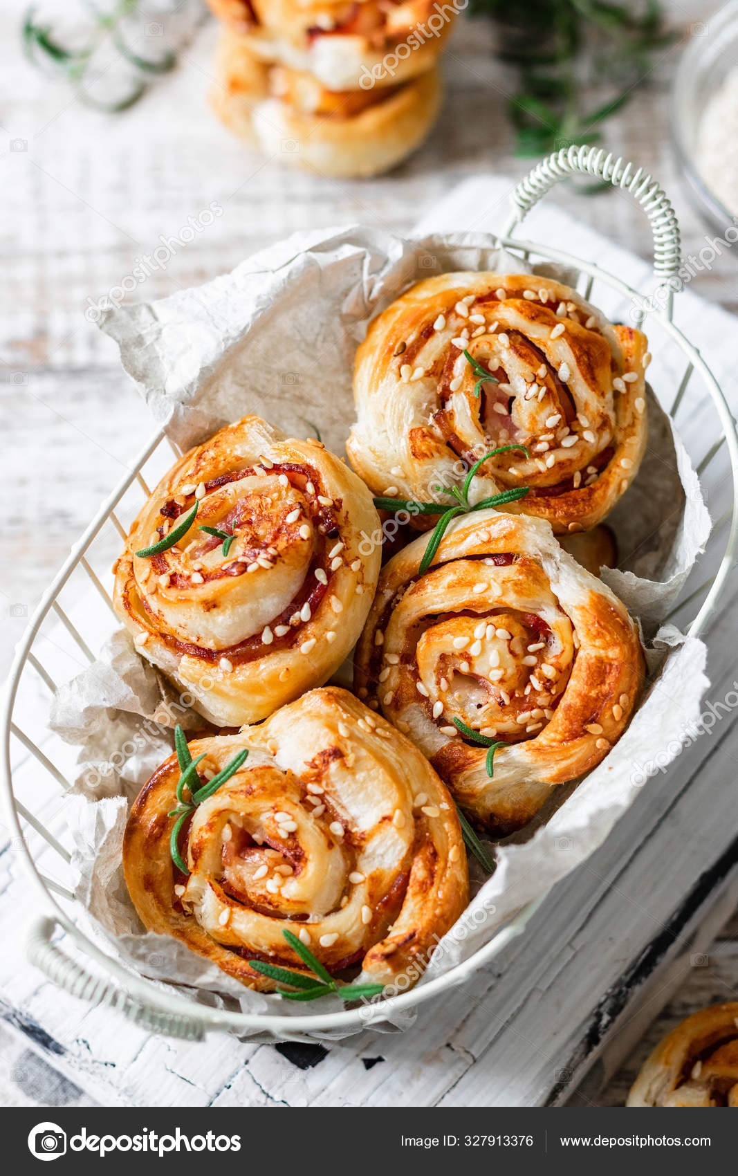 Unsweetened snails and puff pastry with bacon, sesame seeds and