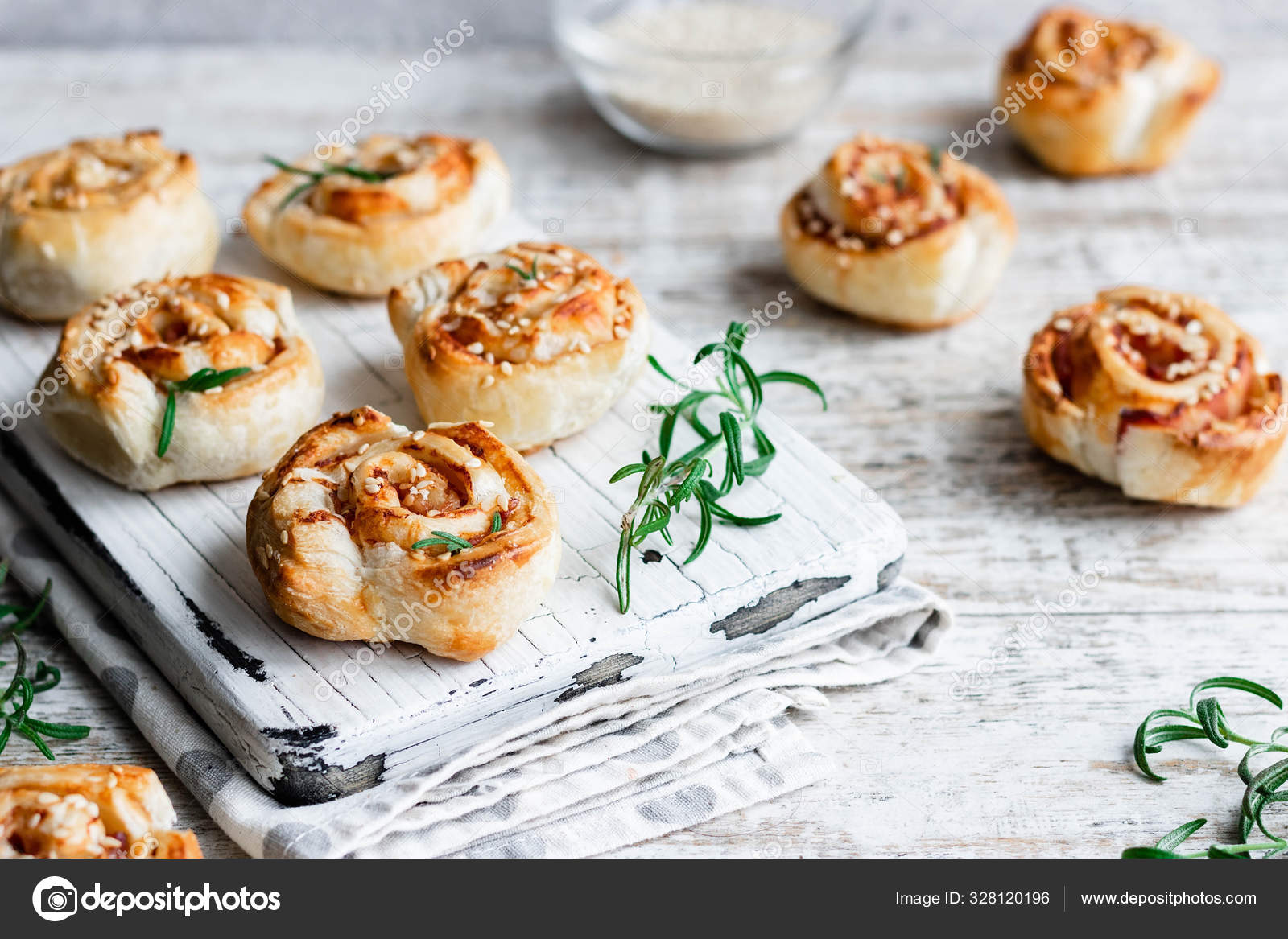 Unsweetened snails and puff pastry with bacon, sesame seeds and