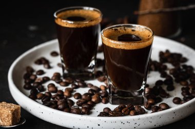 Coffee in glasses. Espresso on a dark background. Dark style clipart
