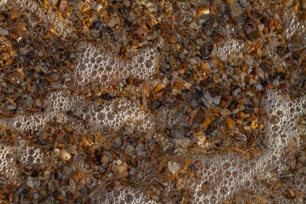 Meer Kieselsteine farbigen Granit am Strand — Stockfoto