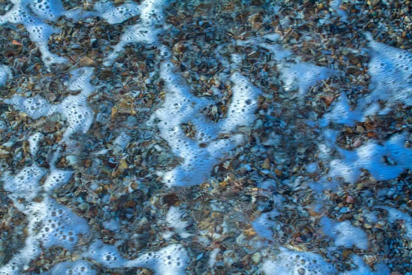 Kamyczki morskie kolorowe granitu na plaży — Zdjęcie stockowe