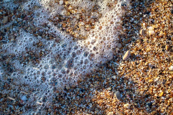 Kamyczki morskie kolorowe granitu na plaży — Zdjęcie stockowe