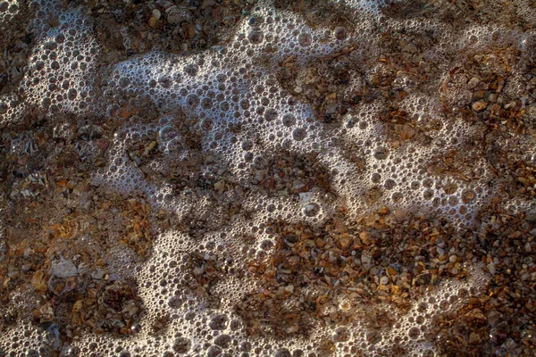 Ciottoli di mare granito colorato sulla spiaggia — Foto Stock