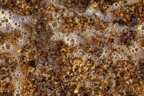 Meer Kieselsteine farbigen Granit am Strand — Stockfoto