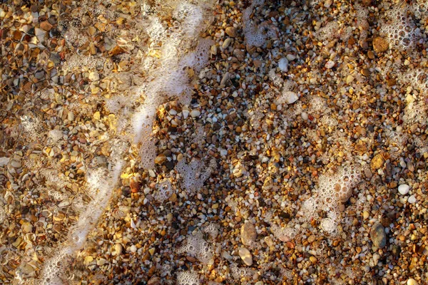 Seixos de mar granito colorido na praia — Fotografia de Stock