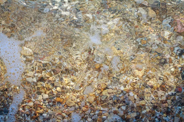 Guijarros de mar de granito de color en la playa —  Fotos de Stock