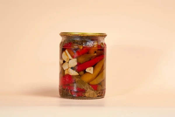 Canned red pepper on dark background — 스톡 사진