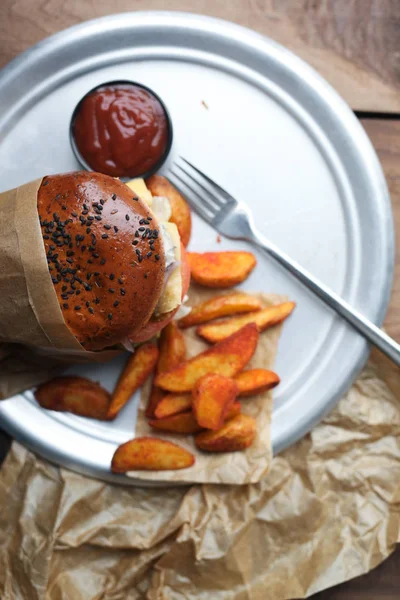 Burger with fried potato slices