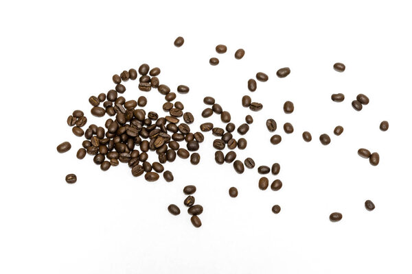 Roasted coffee beans isolated on white background. Close up image.