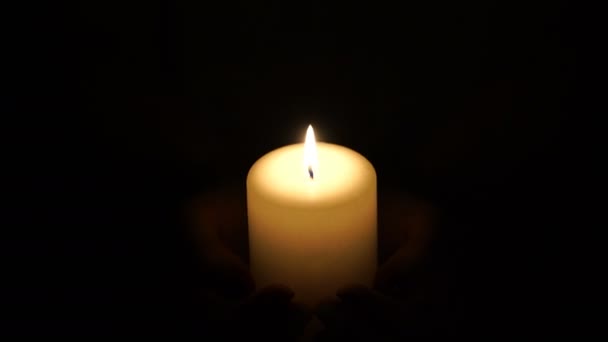 Footage burning candle in the hands of women. 4K — Stock Video