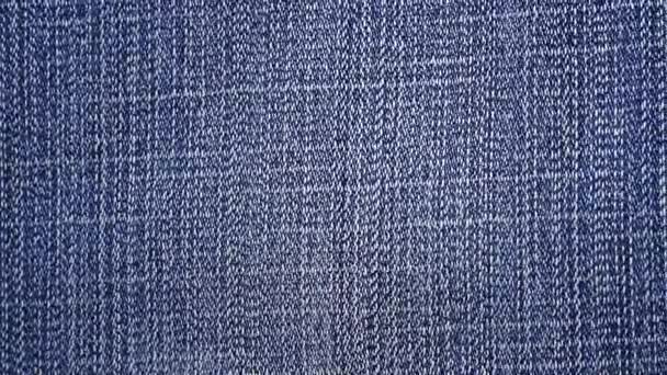 Footage blå denim eller jeans textur bakgrund. — Stockvideo