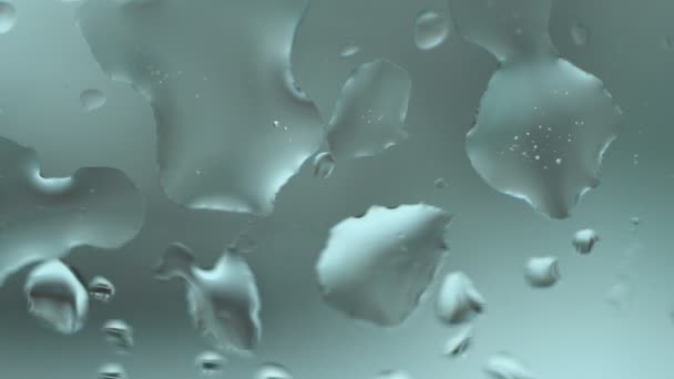 Droppar från snö på glas närbild — Stockvideo