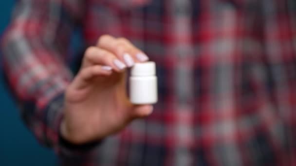 Woman presenting a hand pills — 비디오