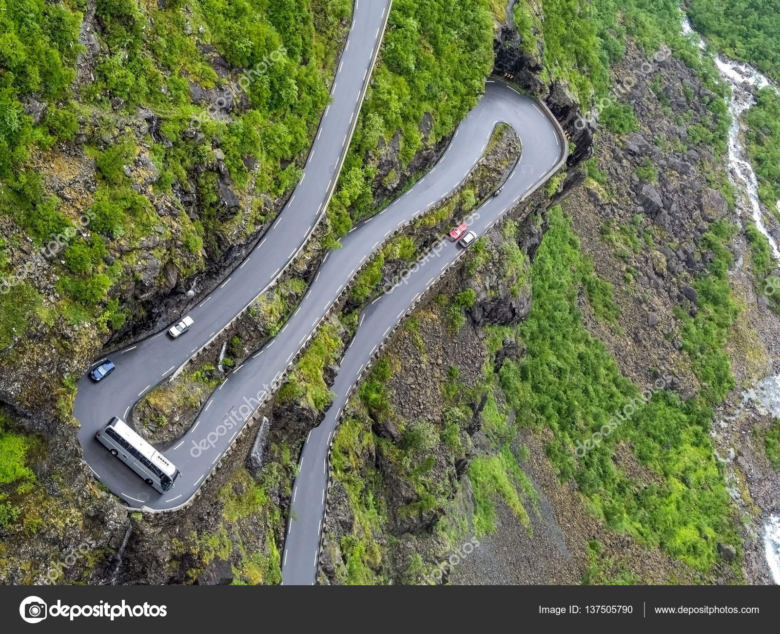 Overhead View Of Coach Going Round Hairpin Bend On Narrow