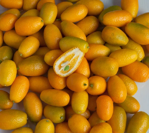 Colorful yellow kumquat background — Stock Photo, Image