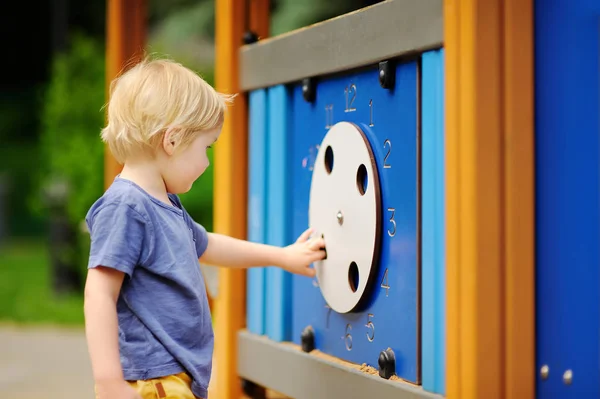 Little boy having fun on outdoor playground or in kindergarten — Stock Photo, Image