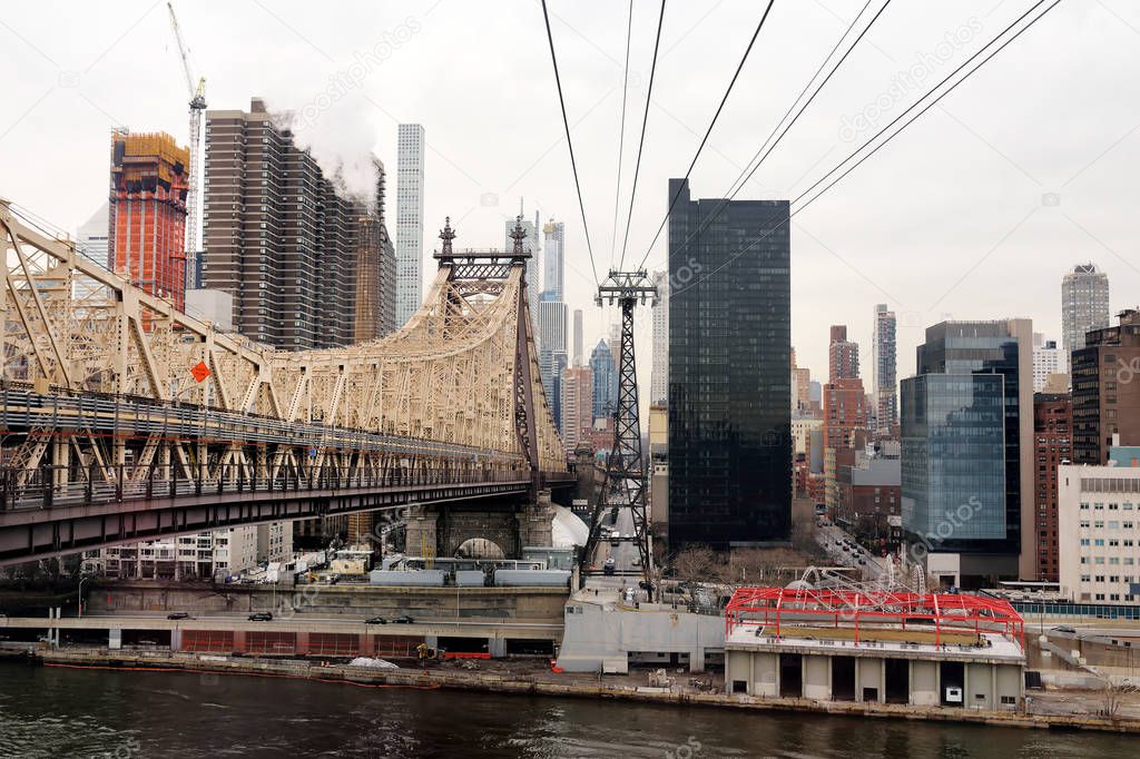 Ed Koch Queensboro Bridge from Manhattan to Queens and famous Roosevelt Island cable tramway. Shot makes from cabin of RIT.