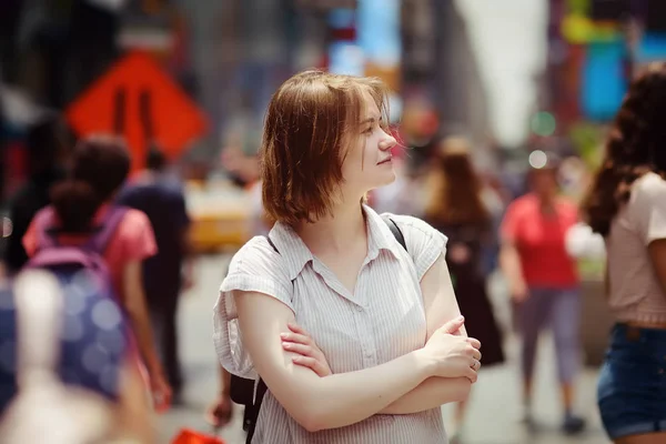 Portrait of charming young woman tourist looking on Times Square on sunny summer day, downtown Manhattan, New York. — Stock Photo, Image