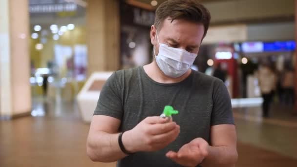 Man Wearing Disposable Medical Face Mask Makes Disinfection Hands Sanitizer — Stock Video