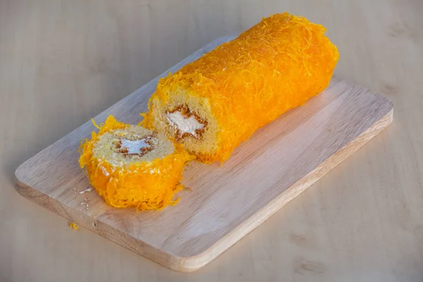 Thai Cake sweetmeat made of egg yolk on wooden table. — Stock Photo, Image