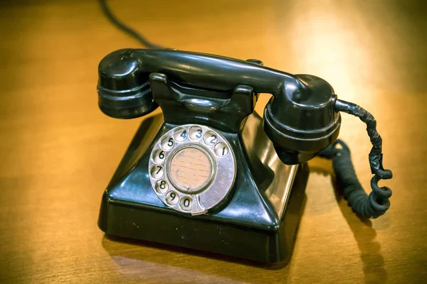 Vintage telephone on wood old table — Stock Photo, Image