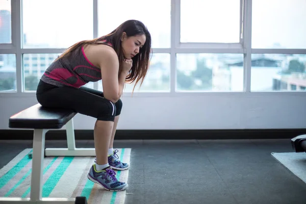 Woman frustrated and tired in sport club