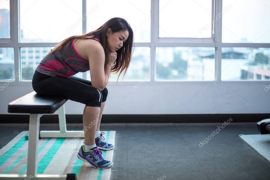 Woman frustrated and tired in sport club