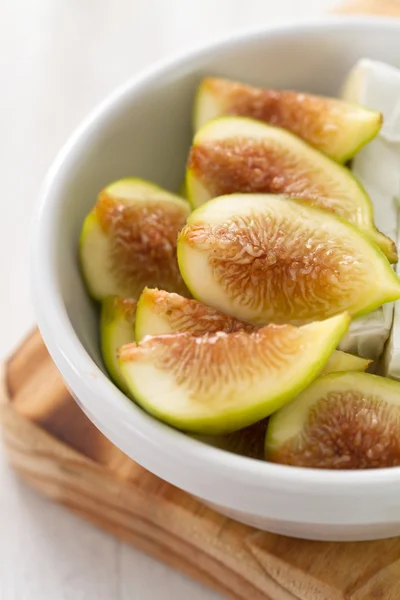 Figs with cheese in white bowl — Stock Photo, Image