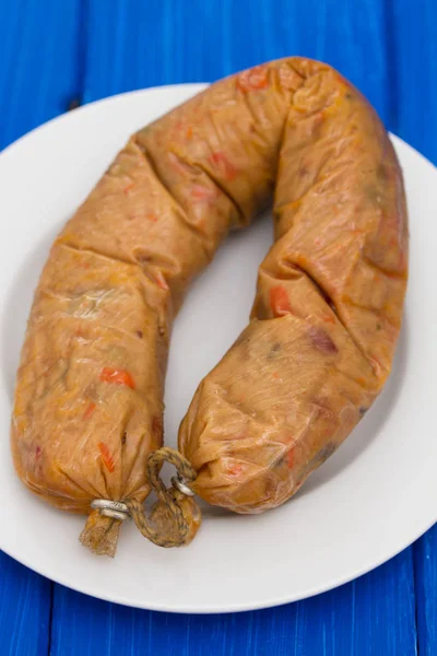Vegetarian smoked sausage on plate — Stock Photo, Image
