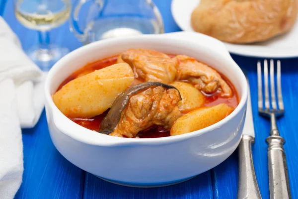 Fish stew on white bowl on wooden background — Stock Photo, Image